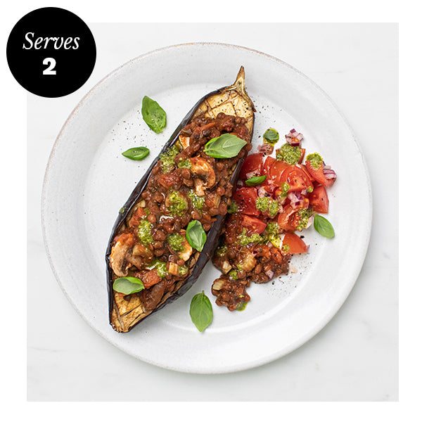 Sundried Tomato & Lentil Ragu on a roasted aubergine with pesto dressed salad